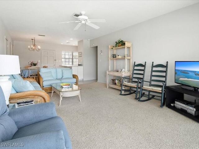 1170 Edington Pl Unit A8, Marco Island, FL 34145 - carpeted living room featuring a chandelier and ceiling fan