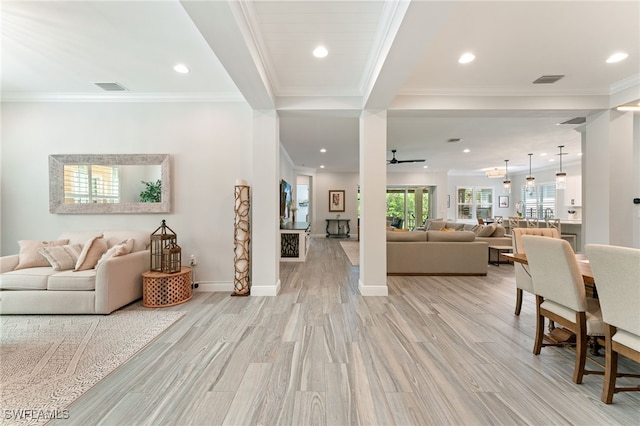 living room with ceiling fan, recessed lighting, crown molding, and light wood-style floors