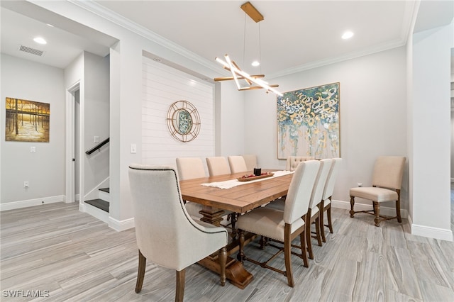 dining space with light wood-type flooring, a chandelier, ornamental molding, stairway, and recessed lighting