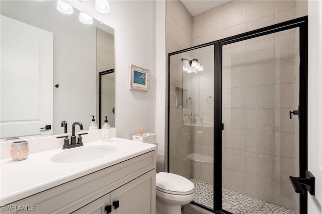 full bathroom featuring vanity and a shower stall