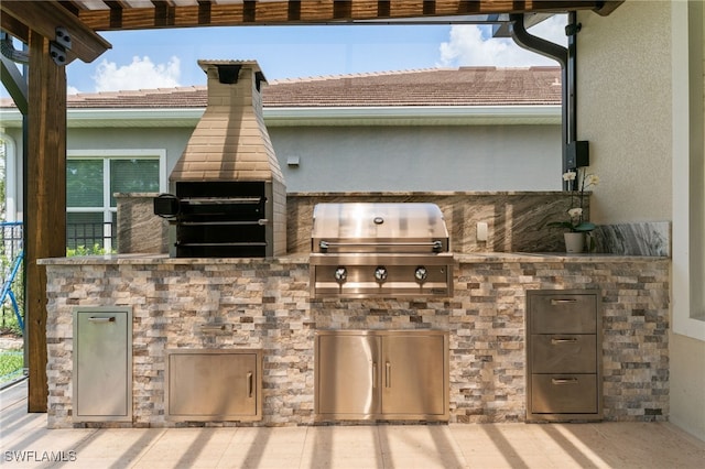view of patio / terrace featuring an outdoor kitchen