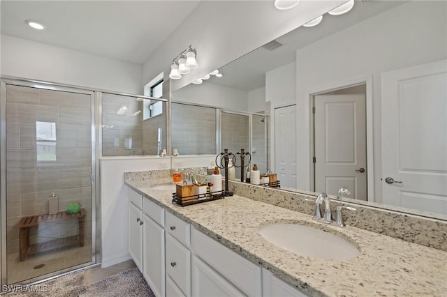 14688 Cantabria Dr, Fort Myers, FL 33905 - bathroom with double vanity, a shower stall, and tile patterned flooring