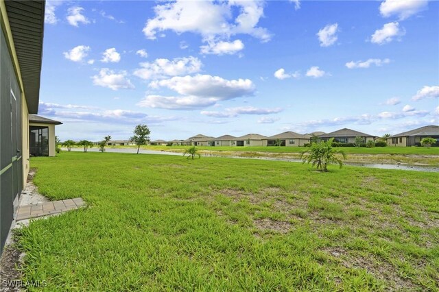 14688 Cantabria Dr, Fort Myers, FL 33905 - view of green lawn with a water view and a residential view
