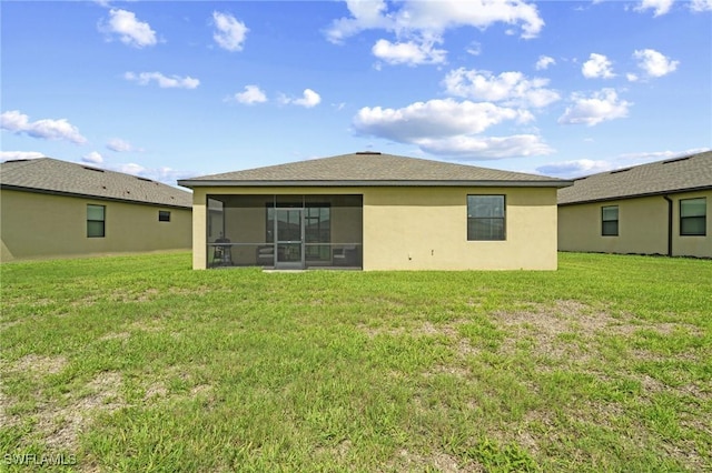 14688 Cantabria Dr, Fort Myers, FL 33905 - rear view of property featuring a sunroom, a lawn, and stucco siding