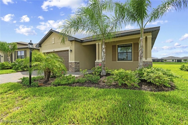14688 Cantabria Dr, Fort Myers, FL 33905 - ranch-style home with stone siding, a garage, stucco siding, a front yard, and driveway