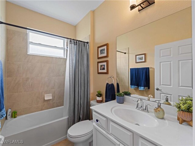 17857 Woodland Ct, Punta Gorda, FL 33982 - bathroom featuring vanity and shower / bath combo with shower curtain