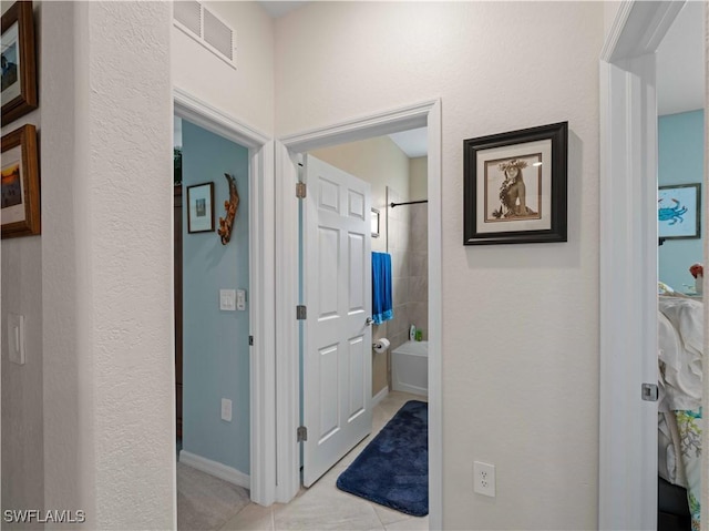 17857 Woodland Ct, Punta Gorda, FL 33982 - hallway with light tile patterned floors