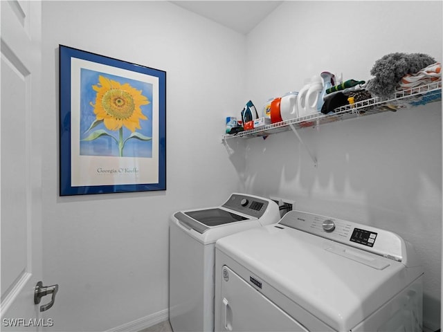 17857 Woodland Ct, Punta Gorda, FL 33982 - laundry room with washer and clothes dryer and baseboards
