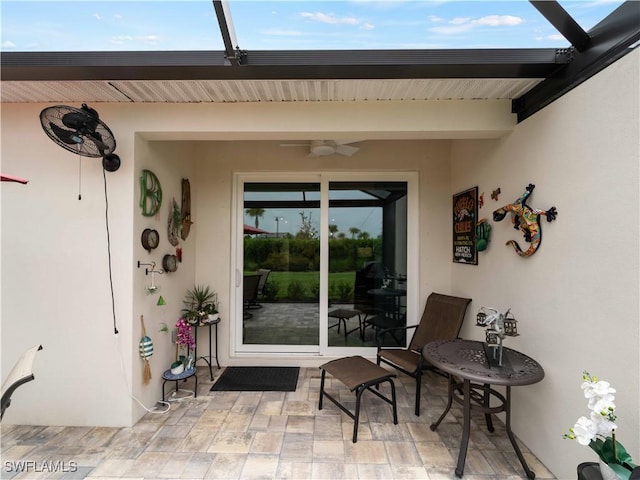 17857 Woodland Ct, Punta Gorda, FL 33982 - entrance to property with ceiling fan, stucco siding, and a patio
