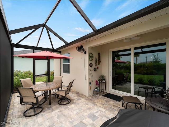 17857 Woodland Ct, Punta Gorda, FL 33982 - view of patio / terrace featuring outdoor dining space, ceiling fan, and glass enclosure