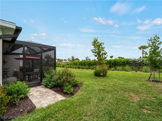 17857 Woodland Ct, Punta Gorda, FL 33982 - view of green lawn featuring a patio and a lanai
