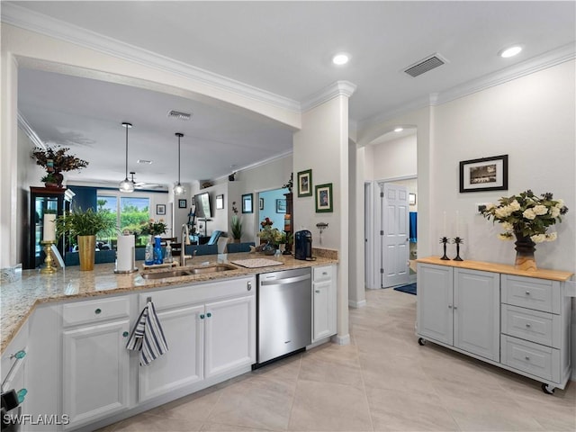 17857 Woodland Ct, Punta Gorda, FL 33982 - kitchen with dishwasher, arched walkways, crown molding, white cabinets, and a peninsula