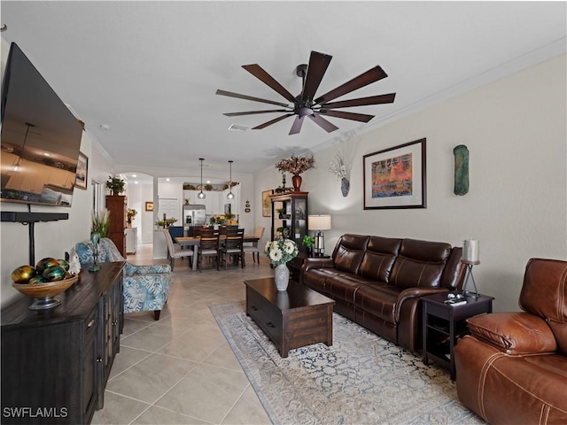 17857 Woodland Ct, Punta Gorda, FL 33982 - living area featuring a ceiling fan, crown molding, and light tile patterned floors