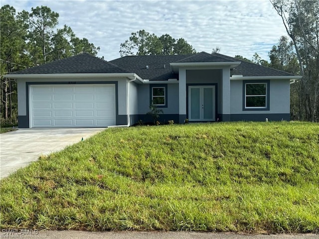 3003 18th St W, Lehigh Acres, FL 33976 - single story home featuring stucco siding, french doors, a garage, concrete driveway, and a front yard