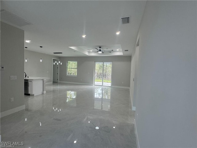 3003 18th St W, Lehigh Acres, FL 33976 - unfurnished room with ceiling fan, a tray ceiling, baseboards, light marble finish flooring, and recessed lighting