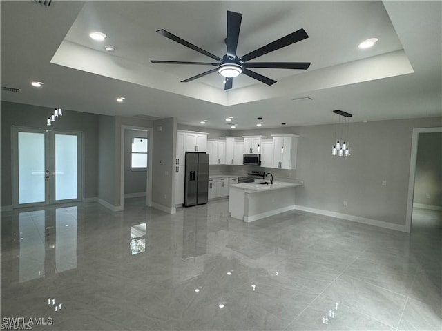 3003 18th St W, Lehigh Acres, FL 33976 - kitchen with stainless steel appliances, a tray ceiling, open floor plan, and recessed lighting