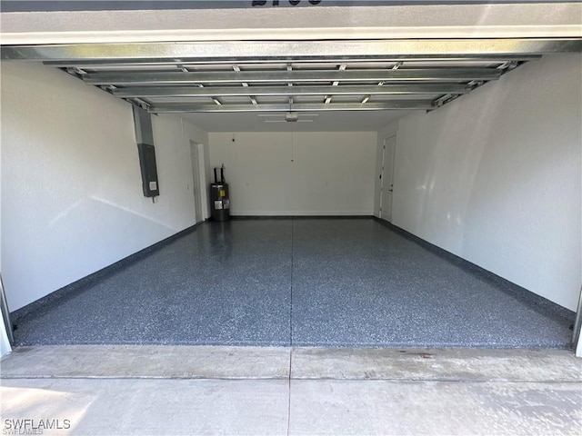 3003 18th St W, Lehigh Acres, FL 33976 - garage featuring electric water heater and electric panel