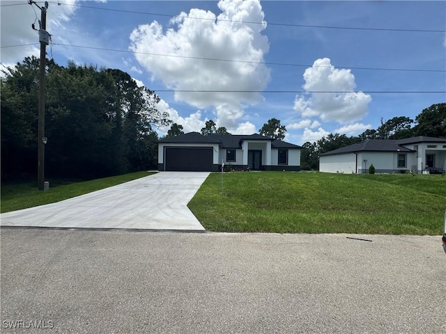 3003 18th St W, Lehigh Acres, FL 33976 - view of front of property with driveway, an attached garage, and a front lawn