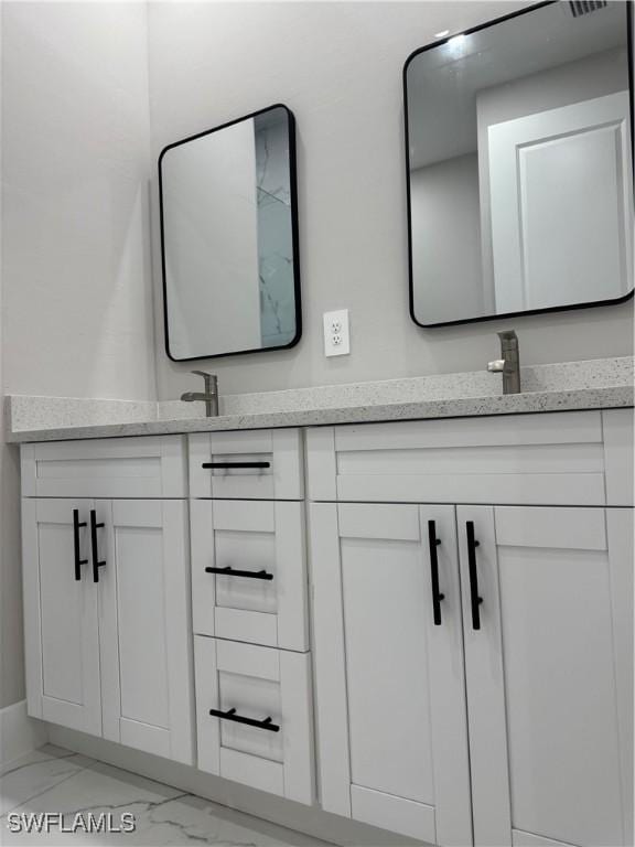 3003 18th St W, Lehigh Acres, FL 33976 - full bathroom with double vanity and marble look tiles