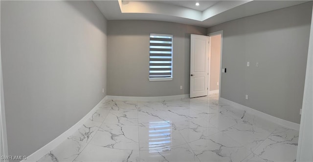3003 18th St W, Lehigh Acres, FL 33976 - empty room with light marble finish flooring, a raised ceiling, and recessed lighting