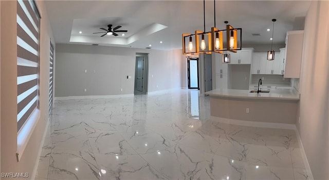 3003 18th St W, Lehigh Acres, FL 33976 - kitchen featuring recessed lighting, a ceiling fan, light marble finish flooring, white cabinetry, and light countertops