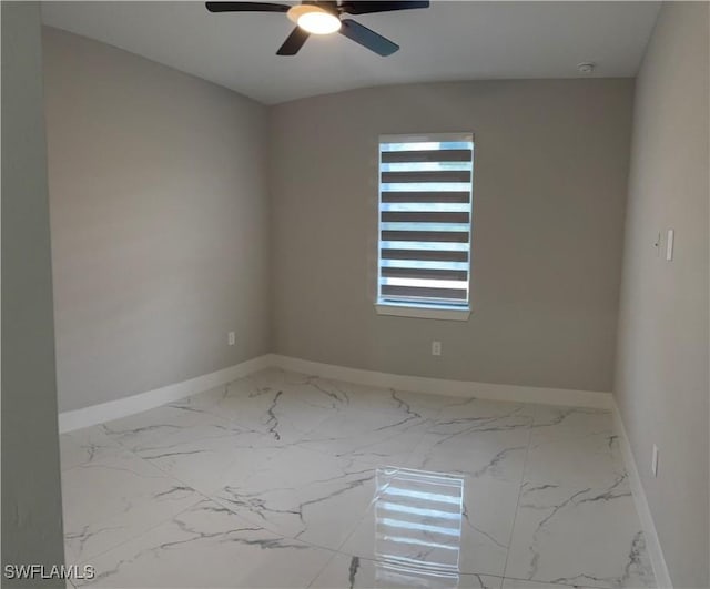 3003 18th St W, Lehigh Acres, FL 33976 - unfurnished room with marble finish floors, ceiling fan, and a smoke detector
