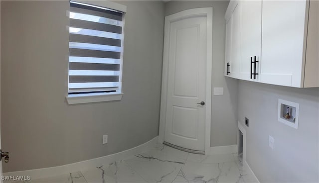 3003 18th St W, Lehigh Acres, FL 33976 - washroom featuring cabinet space, hookup for a washing machine, hookup for an electric dryer, and light marble finish flooring