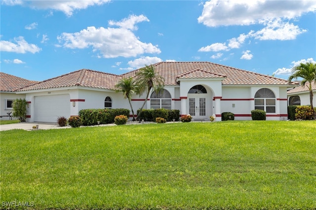3925 Oasis Blvd, Cape Coral, FL 33914 - mediterranean / spanish-style house featuring french doors, a tiled roof, a garage, and a front lawn