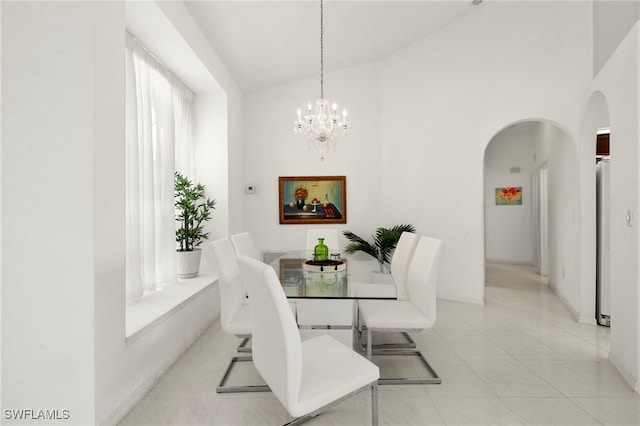 3925 Oasis Blvd, Cape Coral, FL 33914 - dining space with arched walkways, a chandelier, vaulted ceiling, and light tile patterned floors
