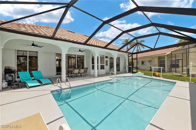 3925 Oasis Blvd, Cape Coral, FL 33914 - swimming pool with a ceiling fan, a patio area, and glass enclosure