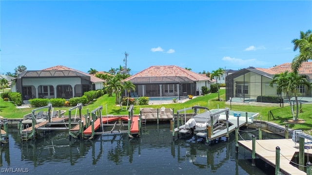 3925 Oasis Blvd, Cape Coral, FL 33914 - dock featuring boat lift, a water view, and a lawn