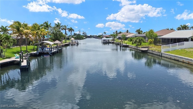 3925 Oasis Blvd, Cape Coral, FL 33914 - water view with a boat dock, nearby suburban area, and boat lift