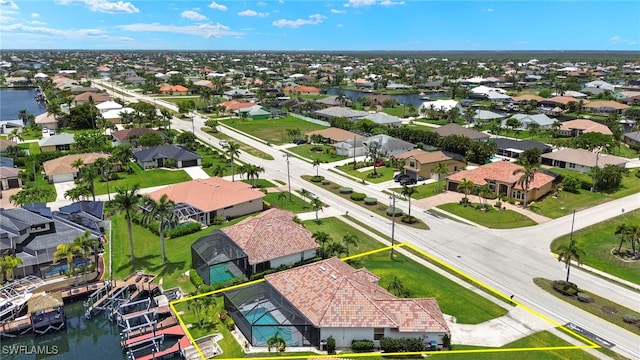 3925 Oasis Blvd, Cape Coral, FL 33914 - aerial perspective of suburban area featuring a nearby body of water and property parcel outlined