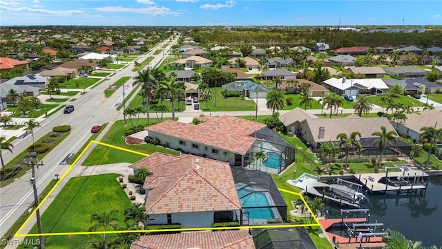 3925 Oasis Blvd, Cape Coral, FL 33914 - aerial perspective of suburban area featuring a large body of water and property parcel outlined