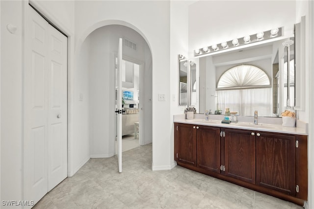 3925 Oasis Blvd, Cape Coral, FL 33914 - bathroom with double vanity, healthy amount of natural light, and a closet