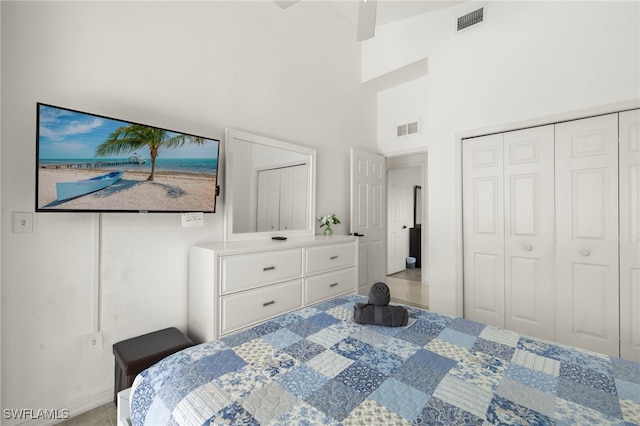 3925 Oasis Blvd, Cape Coral, FL 33914 - tiled bedroom with a towering ceiling, a closet, and a ceiling fan