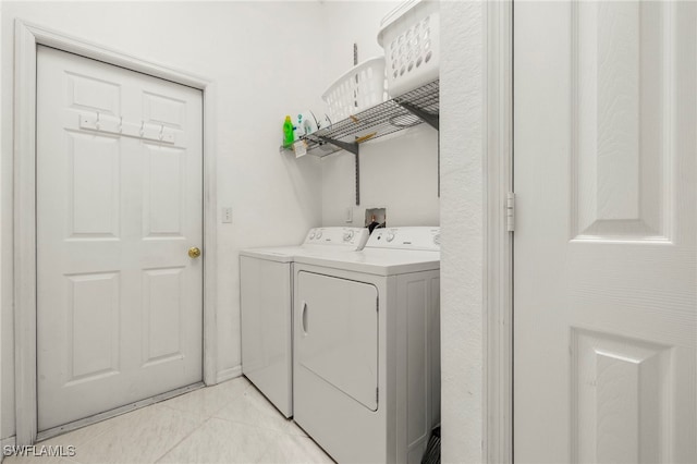 3925 Oasis Blvd, Cape Coral, FL 33914 - laundry room featuring independent washer and dryer and light tile patterned floors