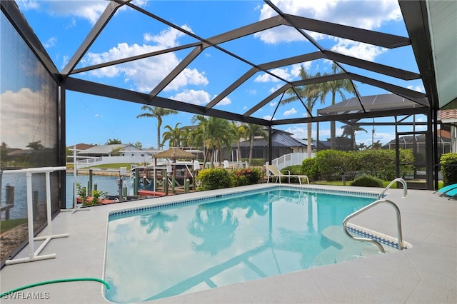3925 Oasis Blvd, Cape Coral, FL 33914 - outdoor pool featuring a patio area, glass enclosure, a dock, and a residential view