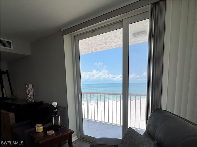 7390 Estero Blvd Unit 702, Fort Myers Beach, FL 33931 - living room featuring view of water and beach and plenty of natural light
