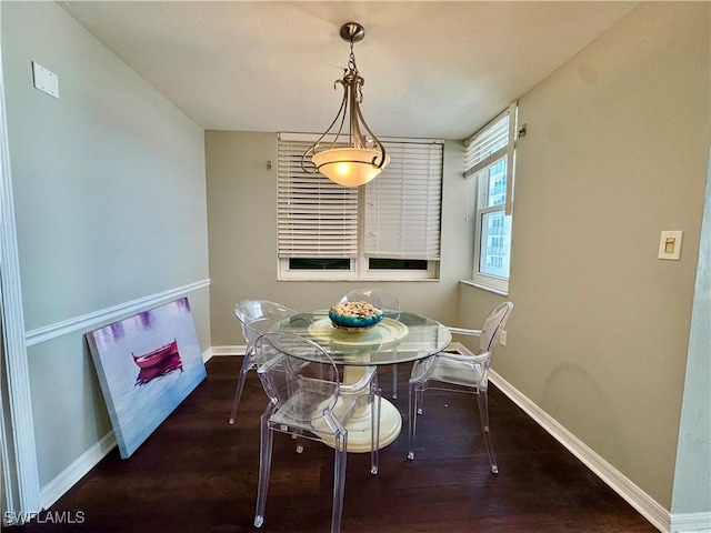 7390 Estero Blvd Unit 702, Fort Myers Beach, FL 33931 - dining space featuring baseboards and wood finished floors