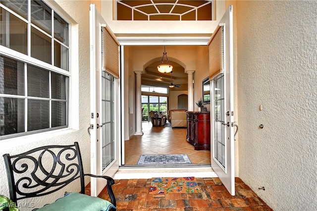 8871 Biella Ct, Estero, FL 33967 - entrance to property with french doors and stucco siding