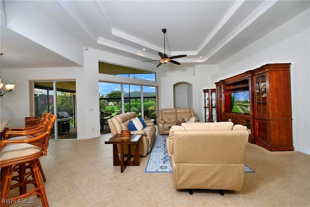 8871 Biella Ct, Estero, FL 33967 - living room featuring ceiling fan, light tile patterned floors, a chandelier, baseboards, and a high ceiling