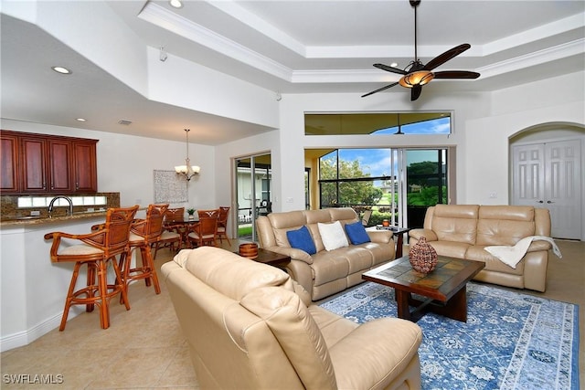 8871 Biella Ct, Estero, FL 33967 - living area featuring a chandelier, a ceiling fan, a towering ceiling, a raised ceiling, and recessed lighting