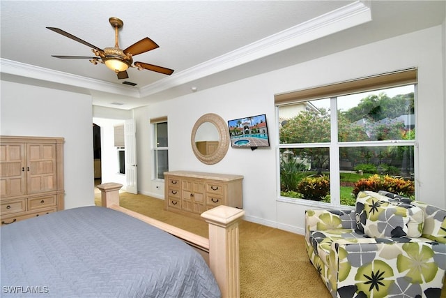 8871 Biella Ct, Estero, FL 33967 - bedroom with crown molding, a tray ceiling, light colored carpet, baseboards, and ceiling fan