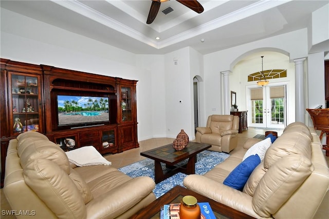 8871 Biella Ct, Estero, FL 33967 - living room with arched walkways, ornate columns, a ceiling fan, light tile patterned floors, and french doors