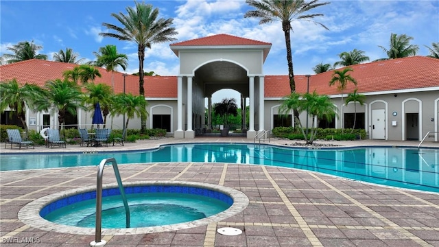 8871 Biella Ct, Estero, FL 33967 - community pool featuring a hot tub and a patio area