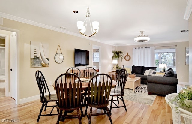 8780 Lueck Ln Unit 4, Fort Myers, FL 33919 - dining room with light wood-style floors, baseboards, crown molding, and plenty of natural light
