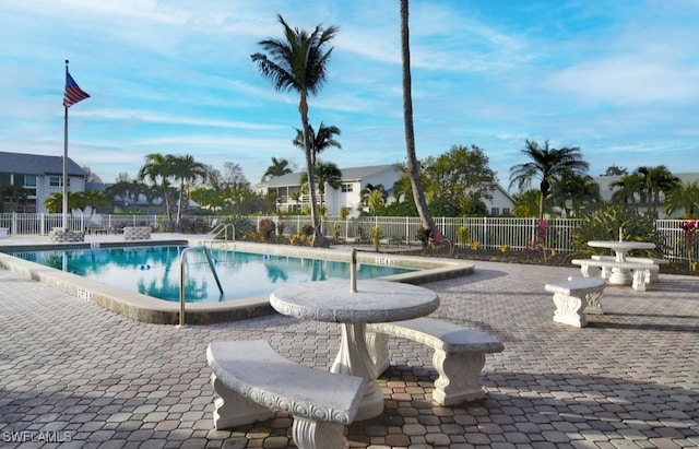 8780 Lueck Ln Unit 4, Fort Myers, FL 33919 - community pool featuring a patio