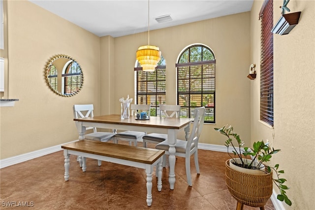 9114 Chula Vista Ln Unit 11901, Naples, FL 34113 - dining space featuring baseboards and a chandelier