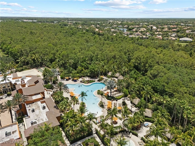 9114 Chula Vista Ln Unit 11901, Naples, FL 34113 - aerial view of property's location featuring a pool and a heavily wooded area